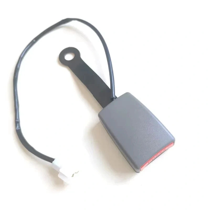 Gray car seat belt buckle with sensor cable and white connector plug