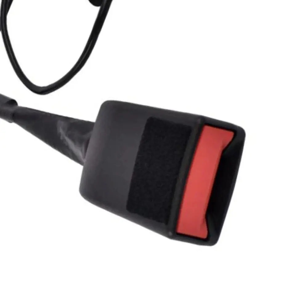 Close-up view of a black front seat belt buckle socket base with a red release button and felt padding strip for Mercedes-Benz models.