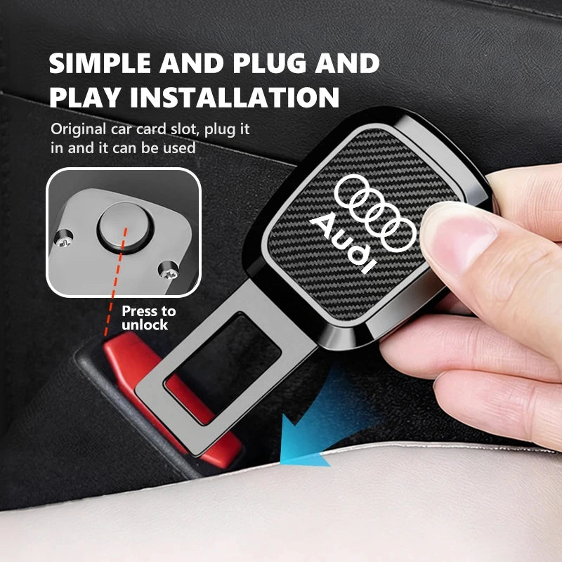 A hand holds a black car seat belt buckle cover with a carbon-fiber pattern and white Audi logo, shown over a red car seat belt buckle. White text at the top explains plug-and-play installation, with a small inset diagram showing the original car card slot.
