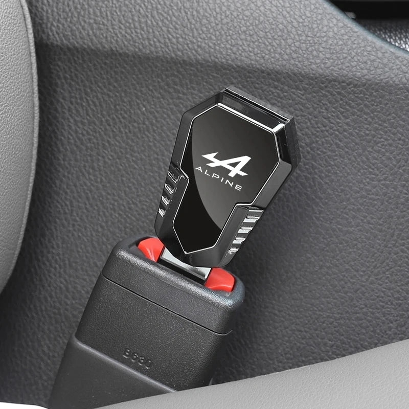 Alpine metal seat belt clip extender inserted into a car seat belt buckle inside the vehicle interior