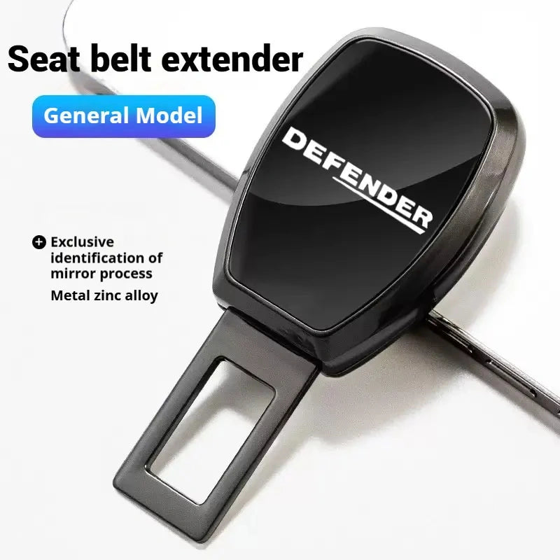 Glossy dark metallic Defender metal seat belt clip extender with white Defender logo