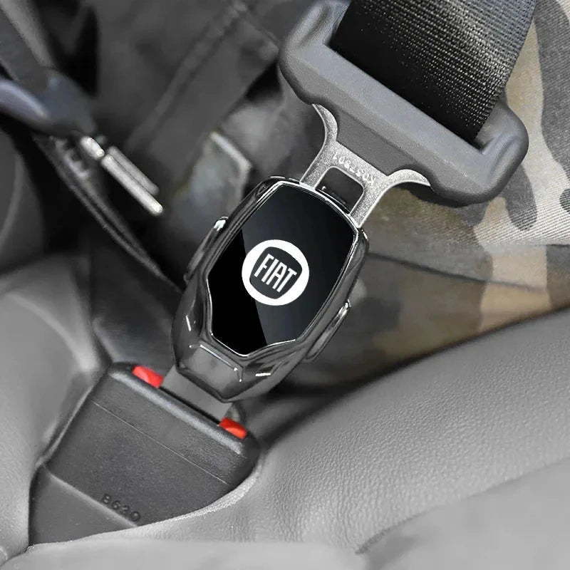 FIAT seat belt extender clip with official FIAT logo plugged into a car seat belt buckl